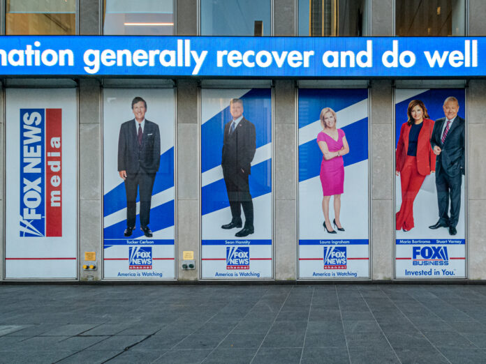 Giant portraits of the news anchors at Fox News